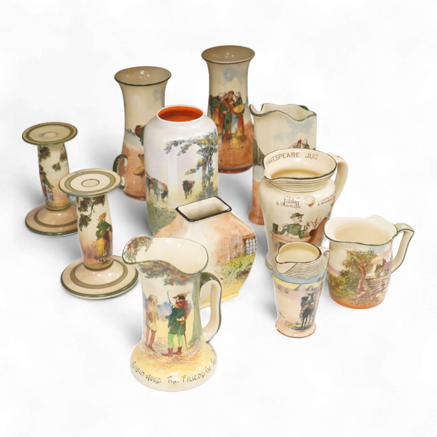 A collection of Royal Doulton series ware jugs, vases and candlesticks, largest 22cm high